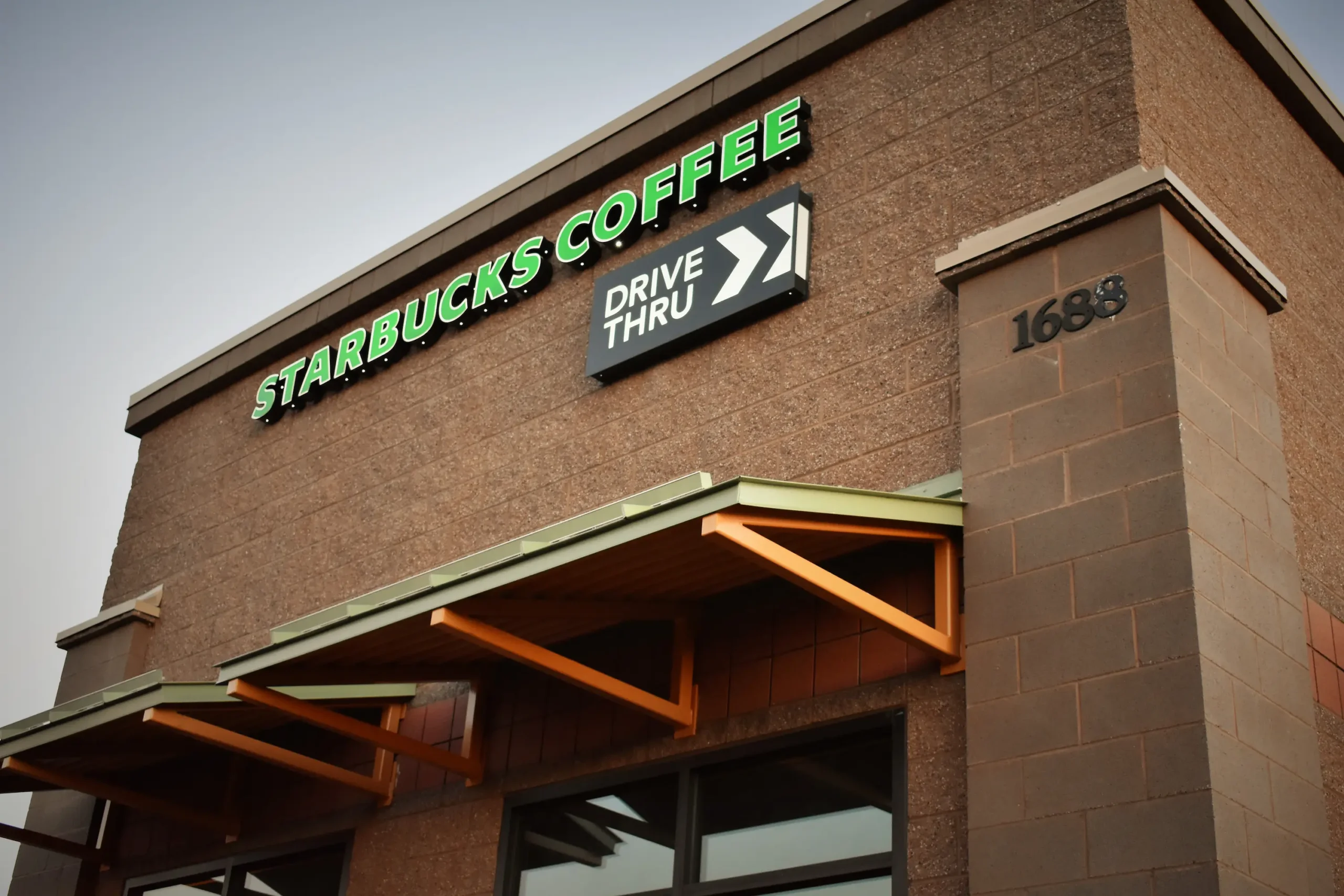 CMU commercial construction Flagstaff AZ — Starbucks Route 66 split face smooth and vertical score concrete masonry exterior