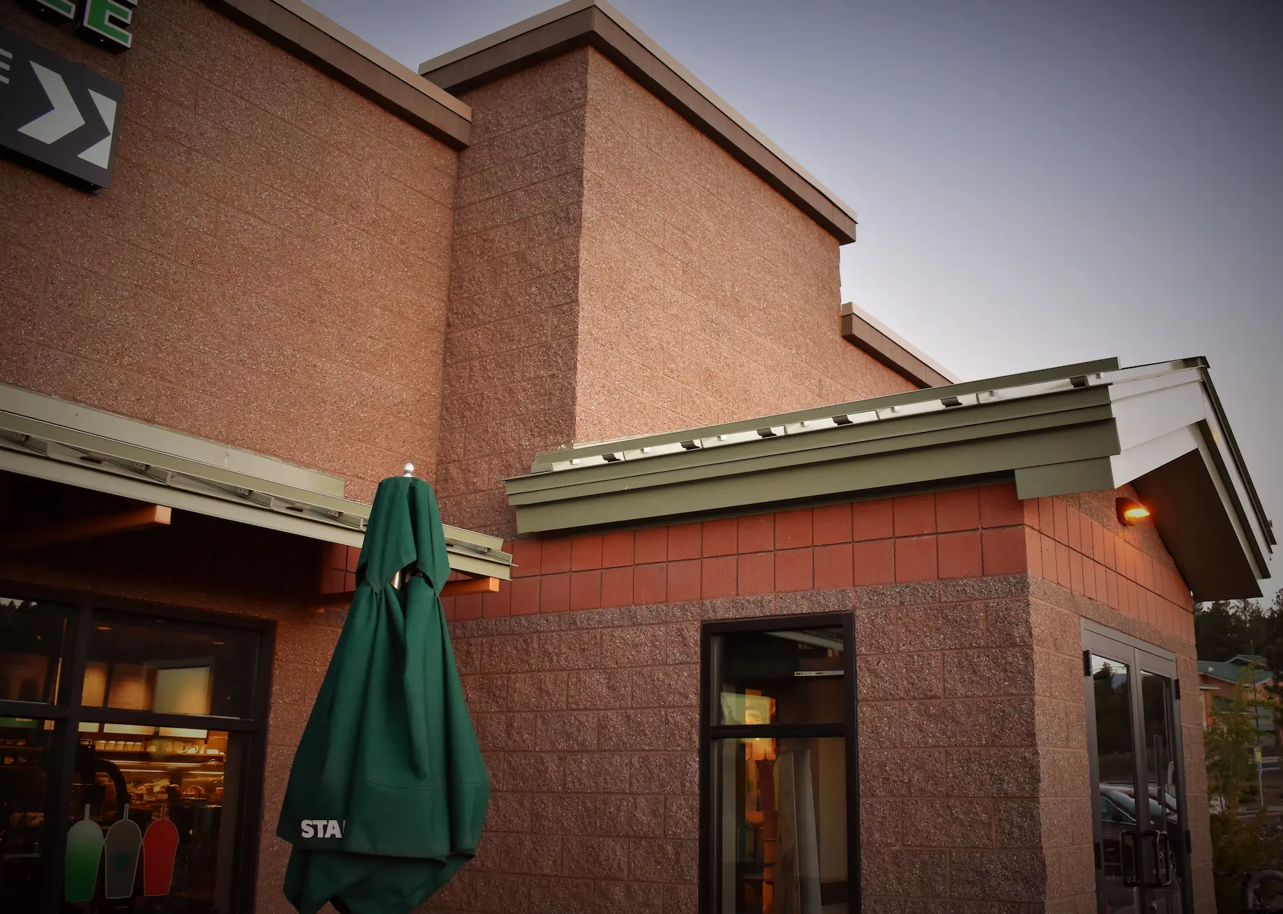 CMU commercial construction Flagstaff AZ — Starbucks Route 66 split face smooth and vertical score concrete masonry exterior