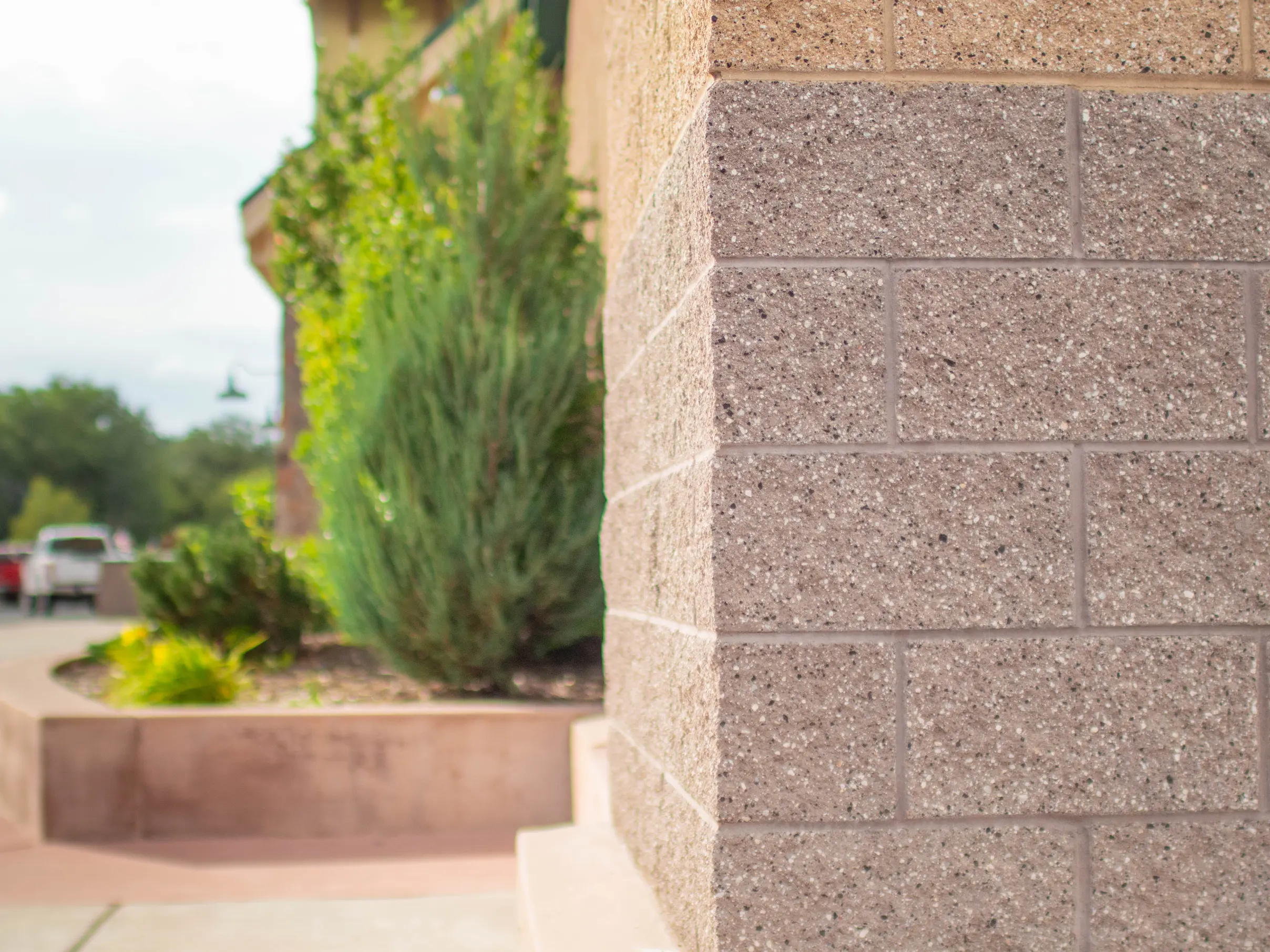 CMU commercial construction Flagstaff AZ — Sportsmans Warehouse split face Doeskin and Bark concrete masonry exterior