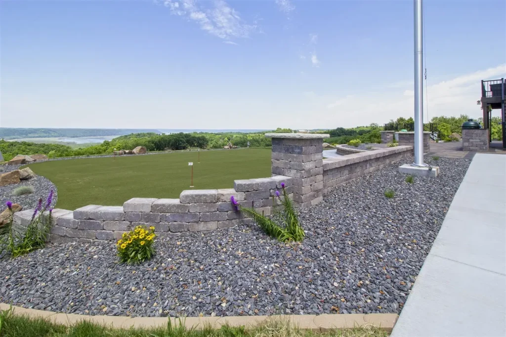 A curved retaining wall using Block-Lite blocks and pavers.